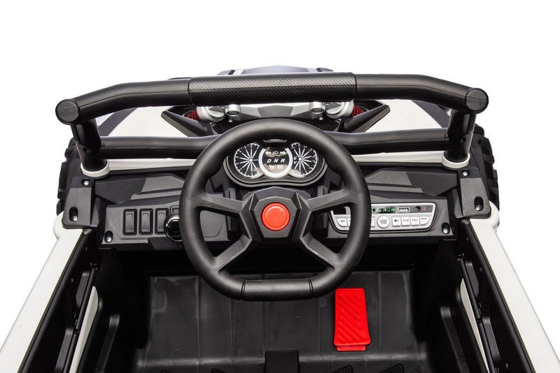 The steering wheel, dashboard and red foot pedal from above