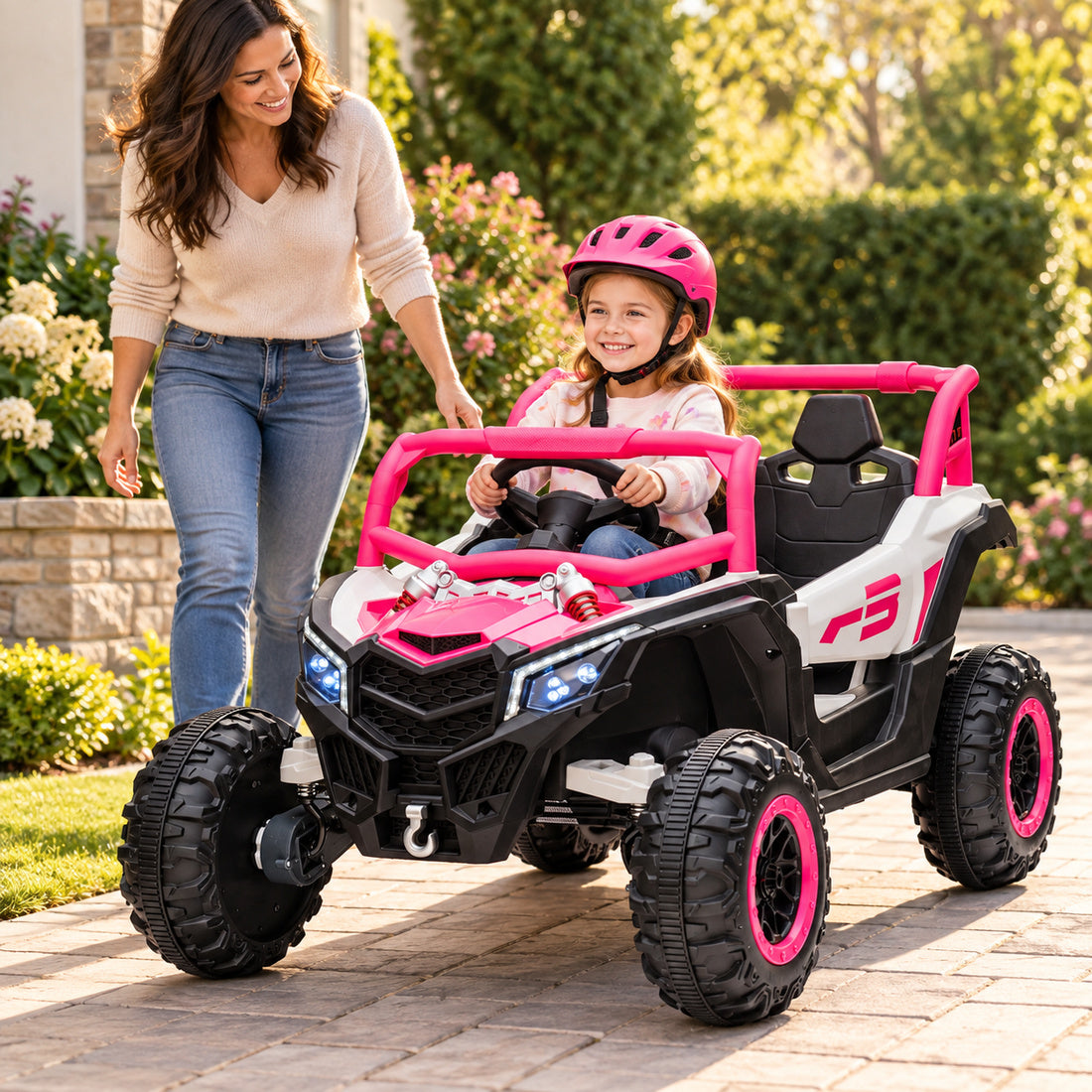 NEL-901A ride-on UTV in Pink – child riding outdoors with a parent