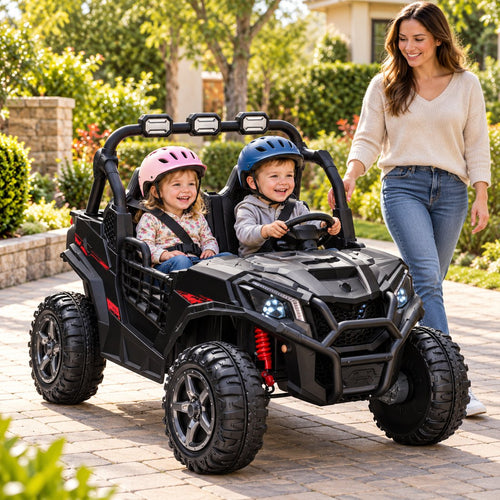 Two children in helmets ride side by side in the black UTV while a parent walks alongside