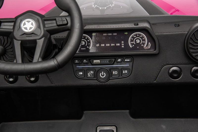 The dashboard with a digital display, music buttons, USB port, start button and gear switches