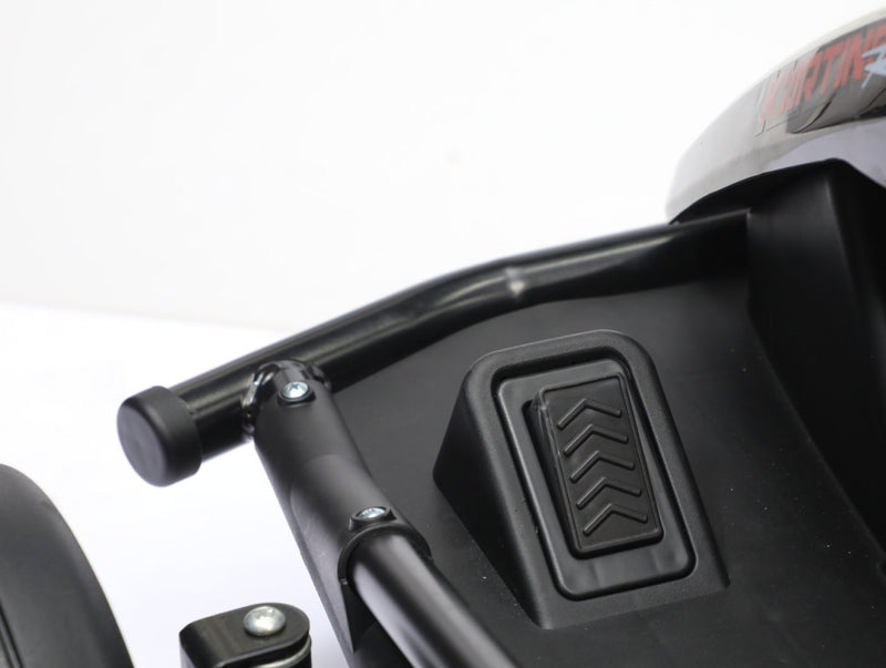 The foot pedal in the kart's footwell