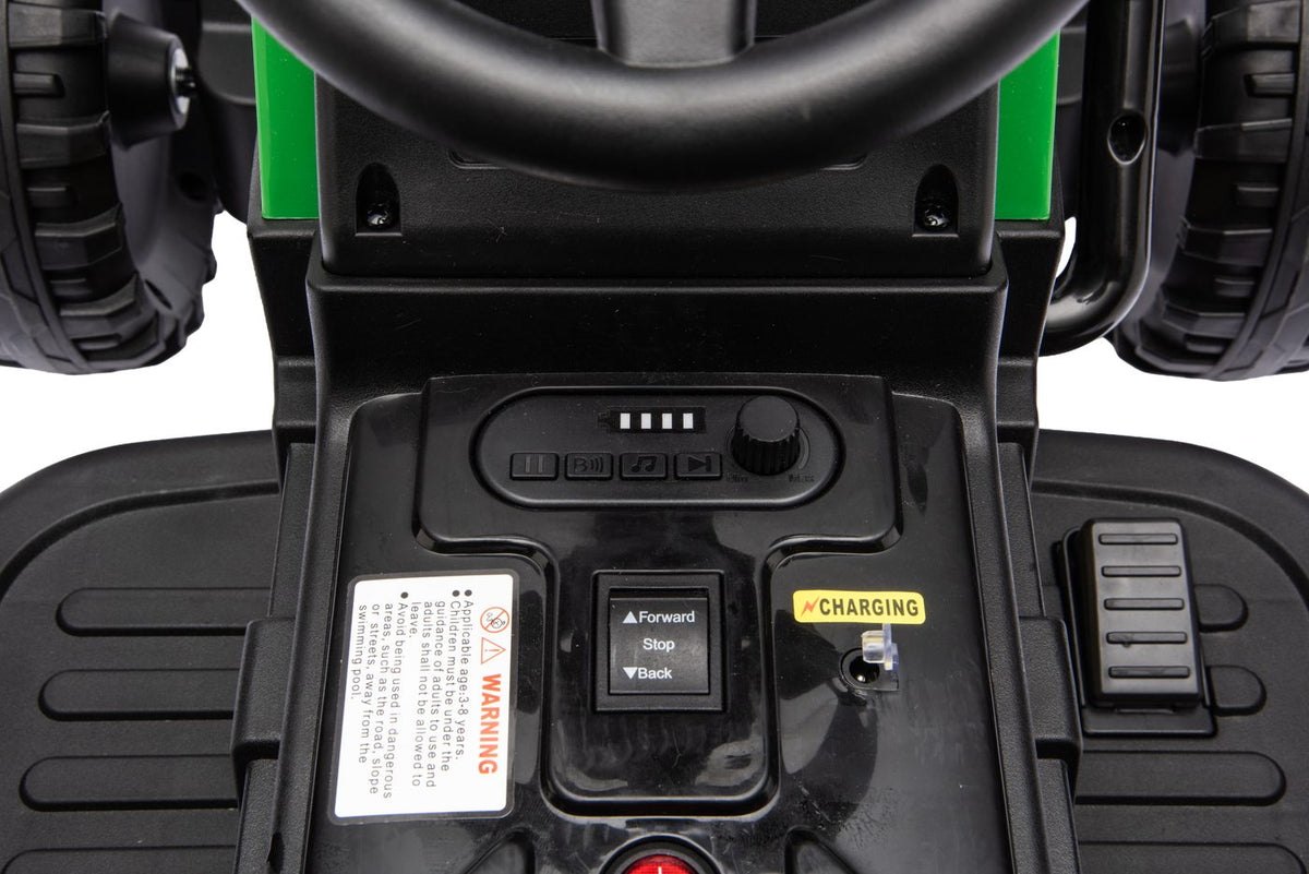 Close-up of the console with forward, stop and reverse switch, battery indicator and music buttons
