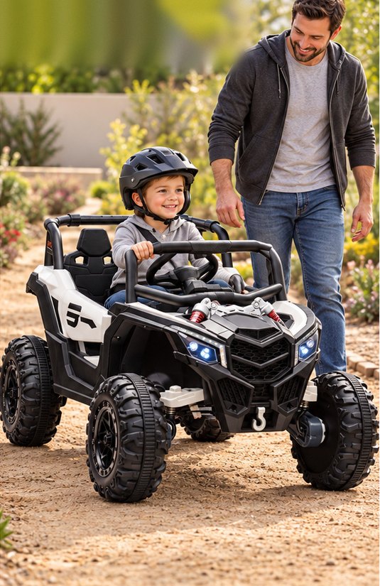 A boy drives the grey-white UTV down a dirt garden path as his dad walks behind