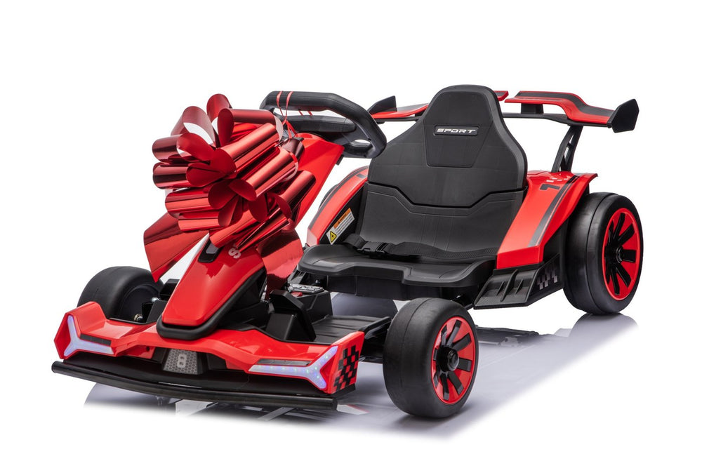 The red go-kart with a big red gift flower bow on the nose
