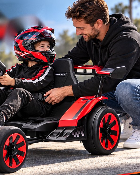 A dad fastens the lap belt for his son, who wears a red helmet, in the red go-kart