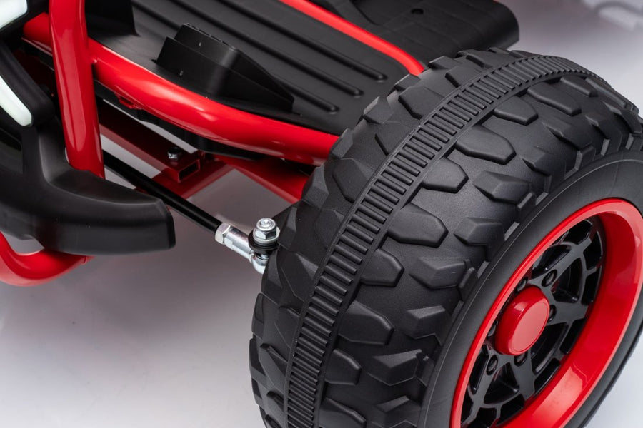 A knobby EVA tire on a red rim
